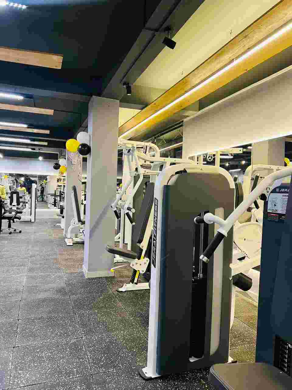 Strength machines on the training floor at The Overload Fitness